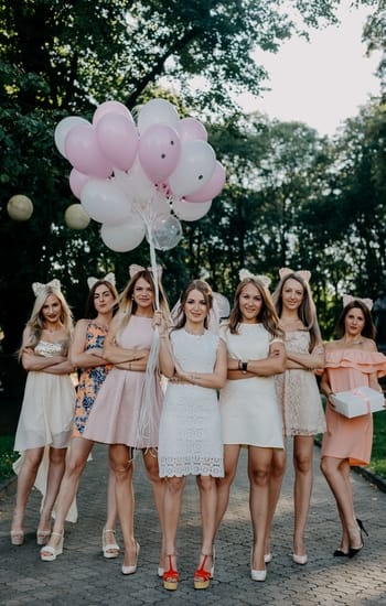 girls standing in same pose